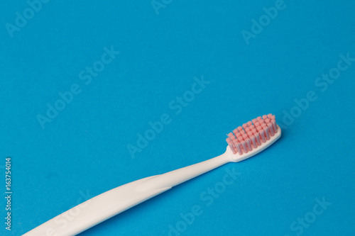 Photo of one pink toothbrush © Sergey