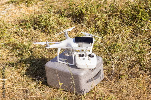 Equipment for driving an unmanned aerial vehicle with a mobile phone and remote control in the field photo