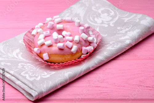 Donut on pink background.