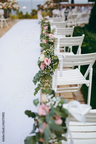 Fototapeta Naklejka Na Ścianę i Meble -  Decoration of chairs at the wedding