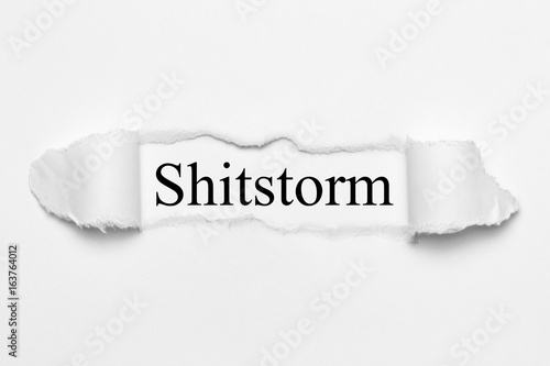 Konstfotografi Shitstorm on white torn paper