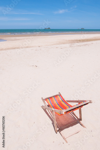 Fototapeta Naklejka Na Ścianę i Meble -  Red canvas chair on the beach.