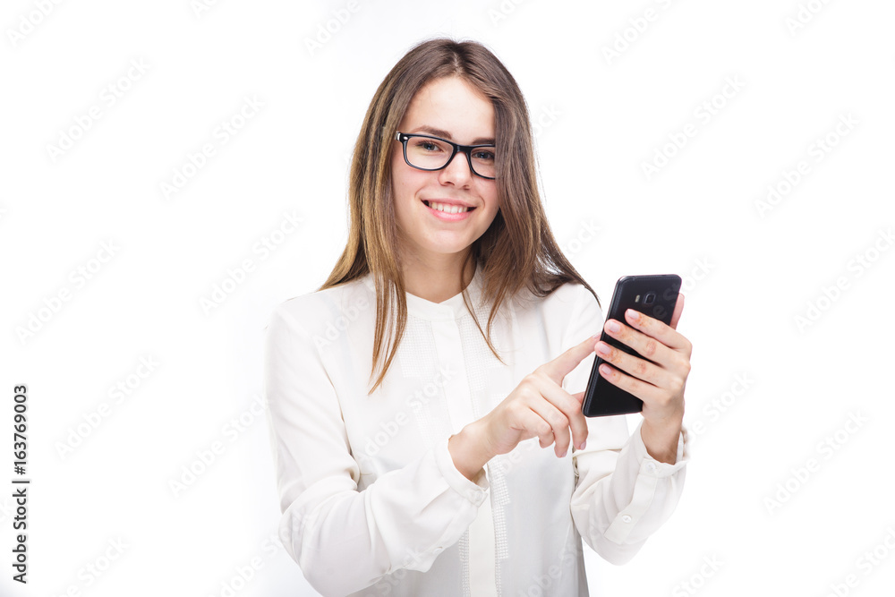 Portrait happy, smiling woman texting on her smart phone, isolated white background. Communication concept. Internet, phone addiction Portrait happy, smiling woman texting on her smart phone, isolated white background. Communication concept. Internet, phone addiction