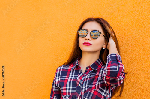 Beauty. Summer sunny lifestyle fashion portrait of young stylish hipster woman, trendy shirt. copy-space