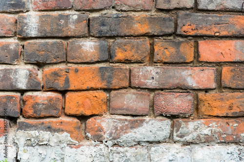 Red old worn brick wall texture background.