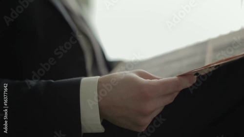 Businessman is reading a newspaper photo