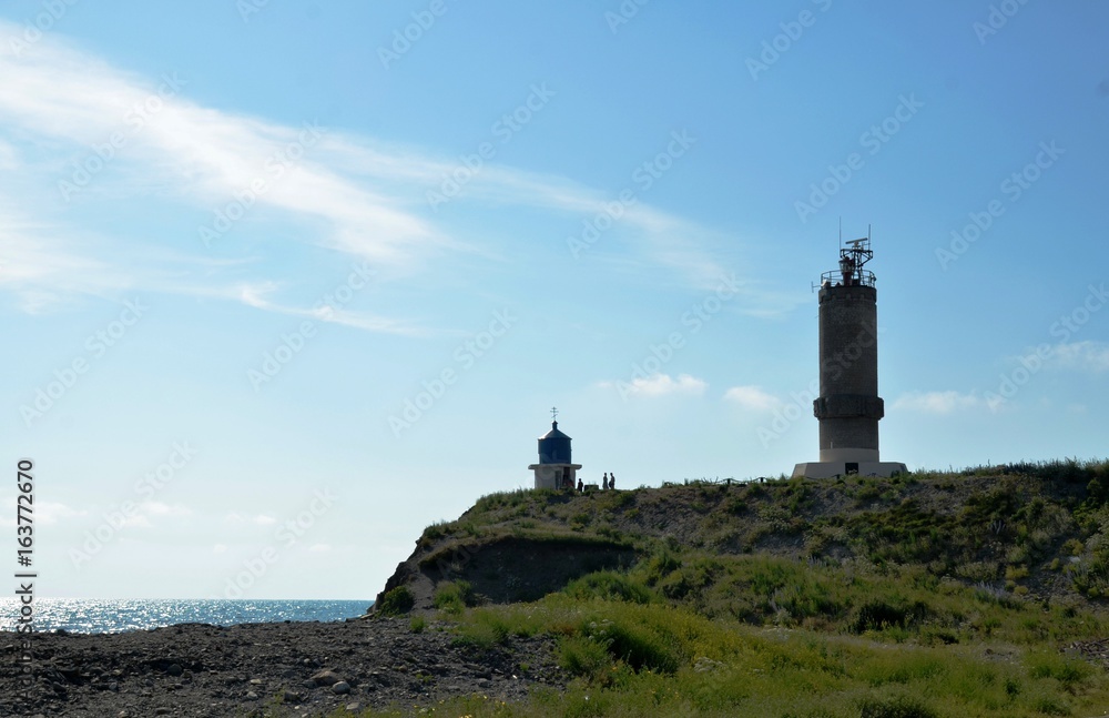 Anapa, Russia - landscape-floristic and marine reserve Bolshoy Utrish. Chapel and lighthouse on the Black Sea coast