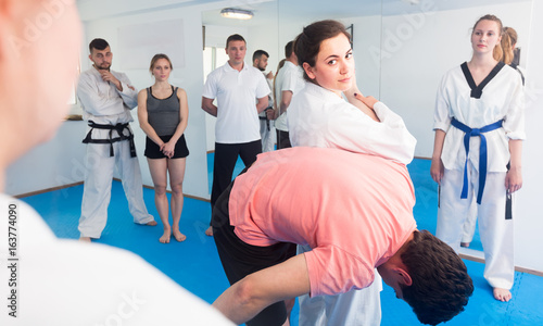 Woman trainer shows defense methods