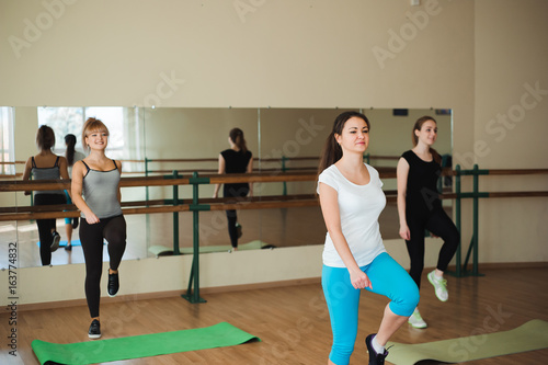Sports woman doing aerobics. The concept of diet and healthy food and lifestile