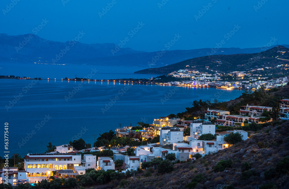 Panoramic night view of the town Elounda, Crete, Greece.Paradice view of Crete island with blue water with light