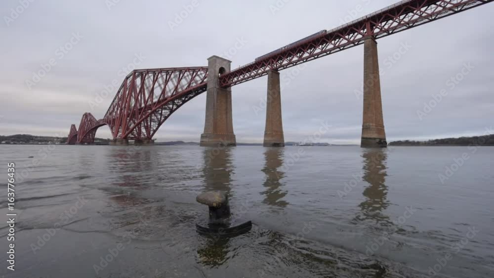 The iconic Forth Rail Bridge, a 19c. cantilever bridge spanning across the Firth of Forth bay, viewed from South-Quennsferry. Near Edinburgh, Scotland, UK The iconic Forth Rail Bridge, a 19c. cantilever bridge spanning across the Firth of Forth bay, viewed from South-Quennsferry. Near Edinburgh, Scotland, UK