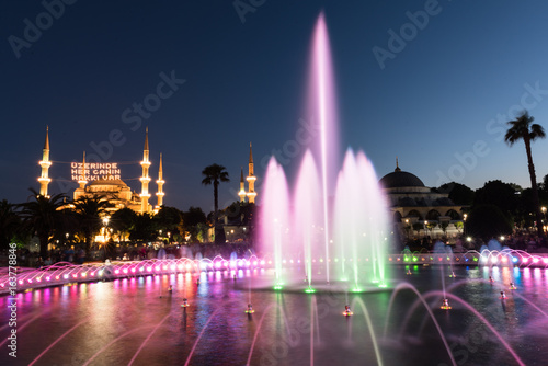 Long exposure photography at Sultanahmet Mosque with fountain in the foreground during Ramadan Mont at Sultanahmet Park, Istanbul, Turkey.