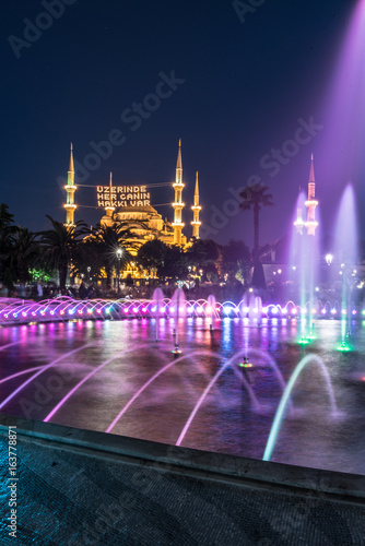 Long exposure photography at Sultanahmet Mosque with fountain in the foreground during Ramadan Mont at Sultanahmet Park, Istanbul, Turkey.