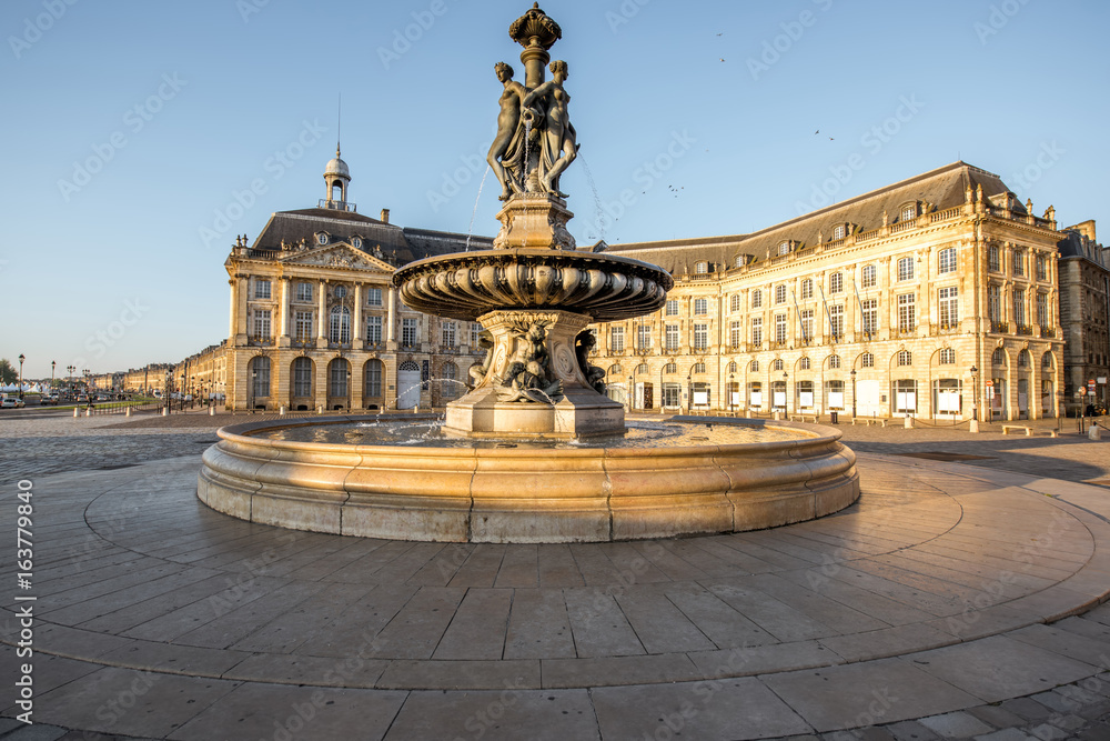 View on the famous Three Graces fountain on La Bourse square during the morning in Bordeaux city, France