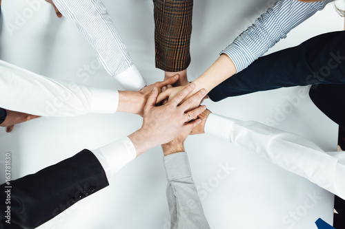 Join Hands Support Together Teamwork Concept on white table