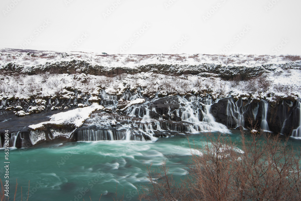 Fototapeta premium Hraunfossar waterfall in winter iceland