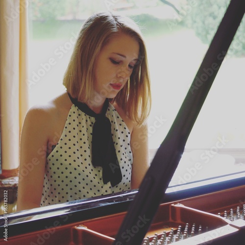Young girl playing the piano