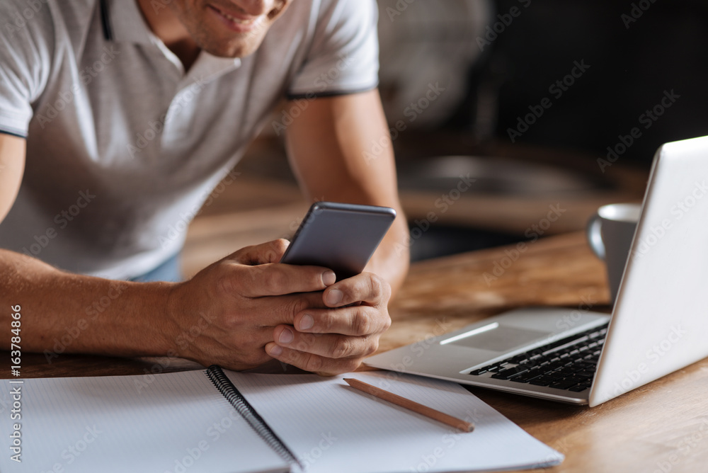 Busy confident man holding his phone Busy confident man holding his phone