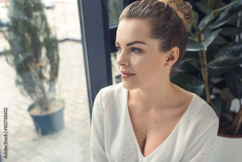 portrait of beautiful stylish businesswoman sitting in modern office Free Download portrait of beautiful stylish businesswoman sitting in modern office - GFXLoad