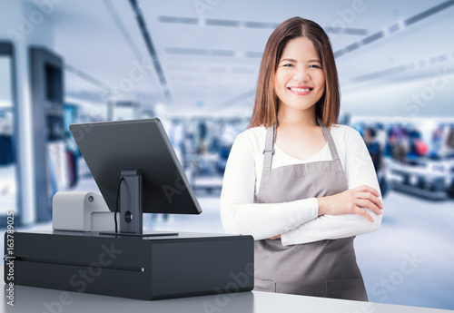 asian worker with cashier desk photo