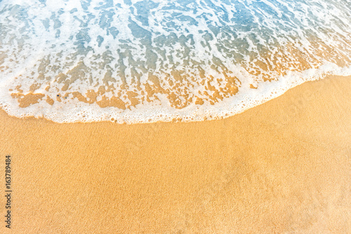 Beach sand and ocean wave