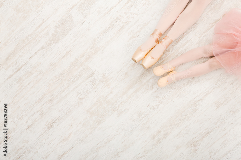 Fototapeta premium Ballerinas in pointe ballet shoes, graceful legs
