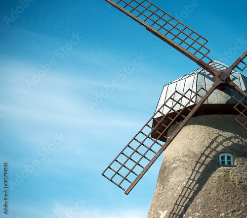 Portrait of classic old tower windmill.