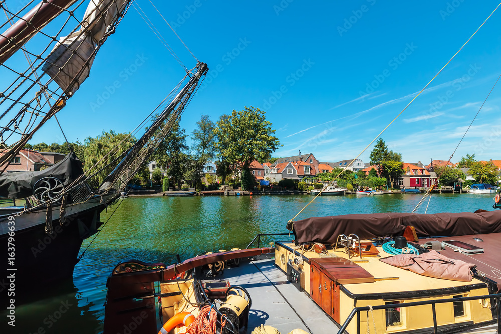 Ancient sailing ships on the Dutch river Vecht