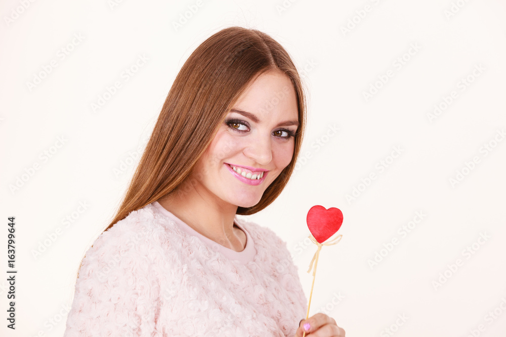 Beautiful woman holding heart shaped hand stick Beautiful woman holding heart shaped hand stick