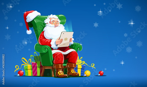 Santa claus sit in armchair with tablet. Christmas character