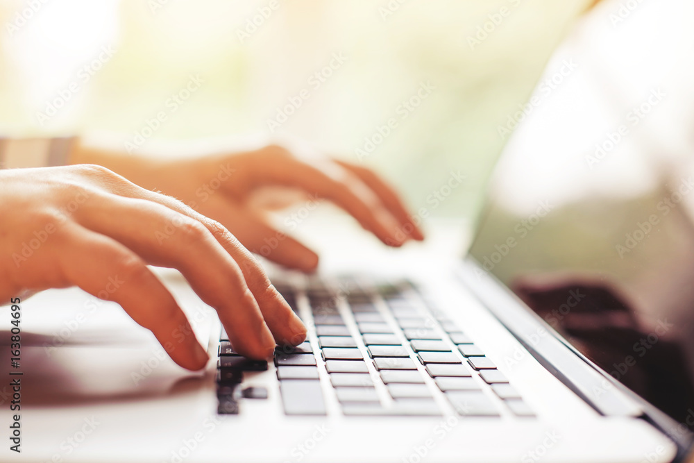 Fototapeta premium hands with laptop typing