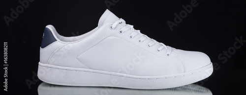 Male White Sneaker on Black Background, Isolated Product, Top View, Studio.