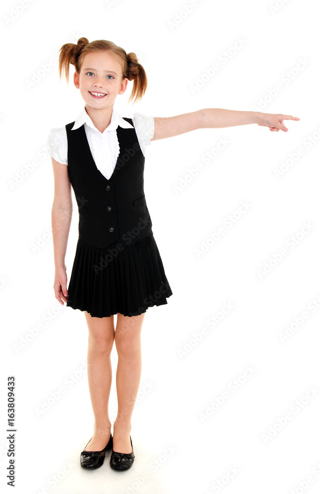 Smiling happy school girl child in uniform showing to the right left isolated Smiling happy school girl child in uniform showing to the right left isolated