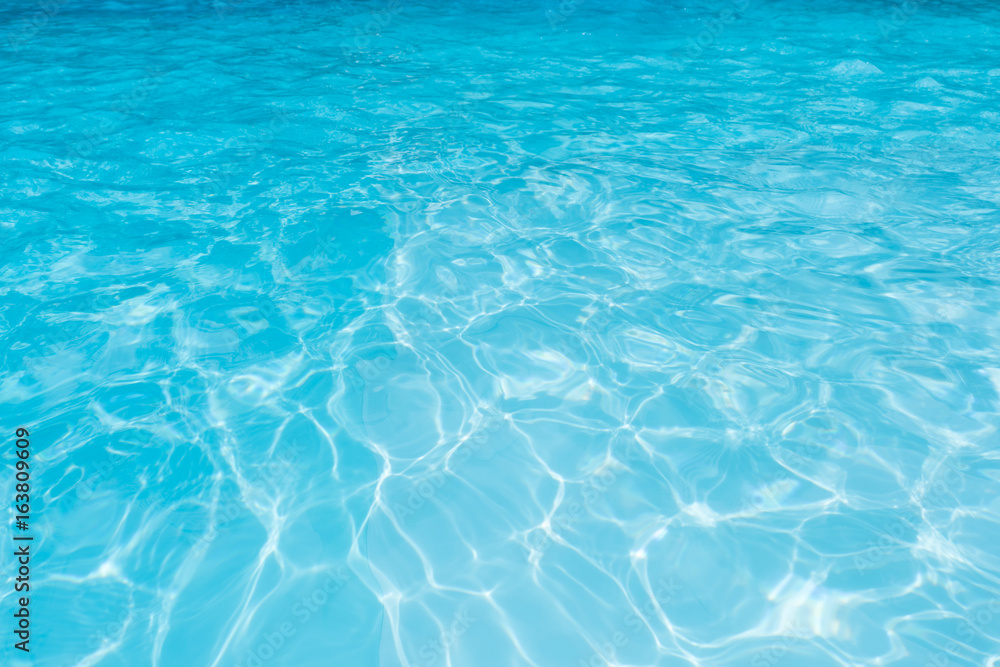 Blue water surface in swimming pool for background