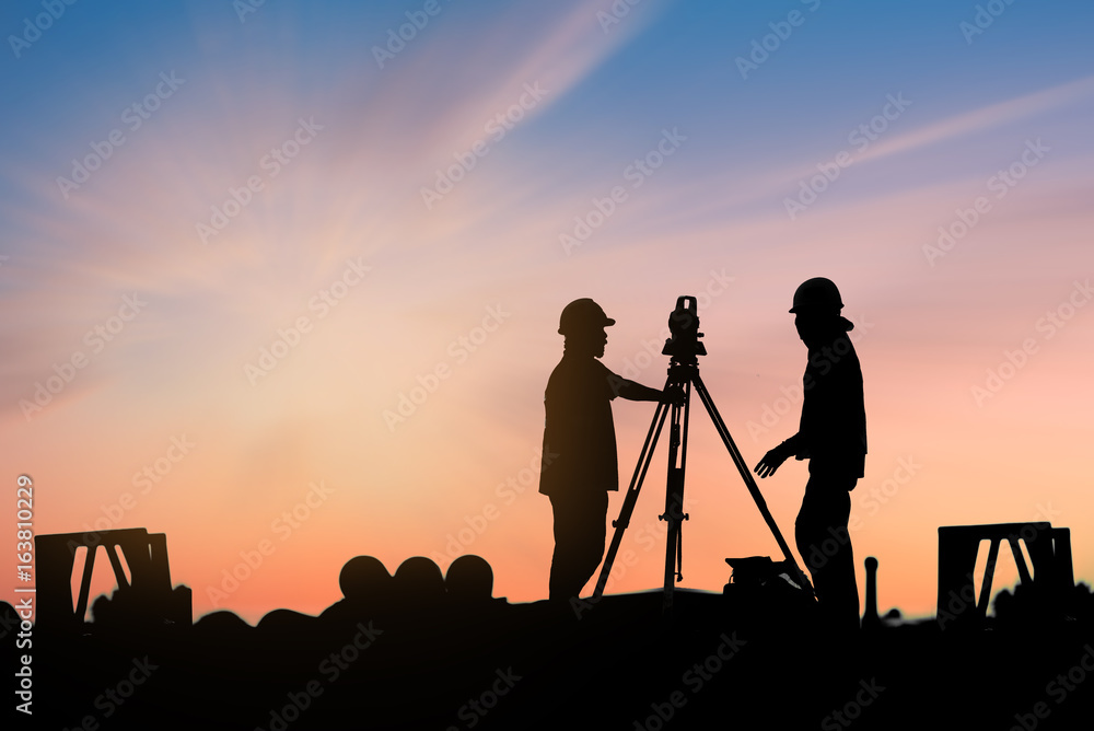 silhouette workers on background of construction silhouette workers on background of construction