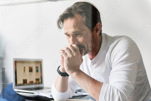 Frustrated senior man suffering from business smash