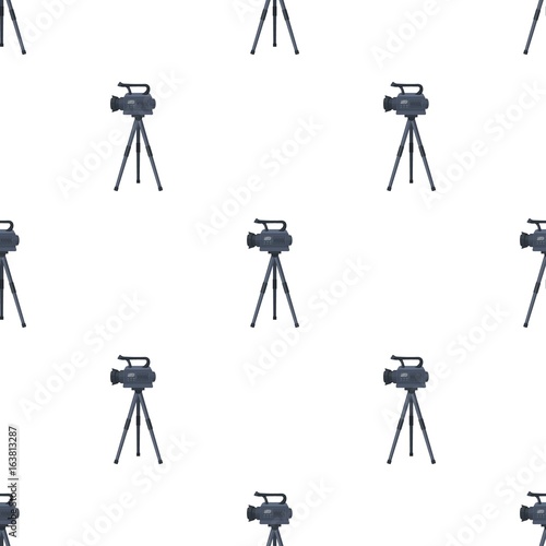 Movie camera on a tripod. Making a movie single icon in cartoon style vector symbol stock illustration web. photo