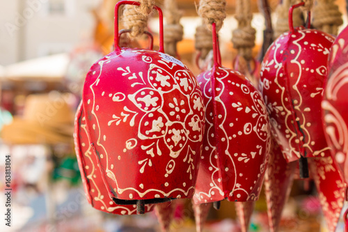 Red souvenir cow bells for sale in Salzburg, Austria © slowcentury