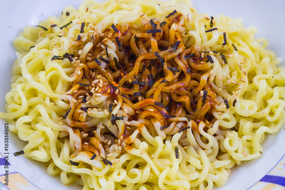 Bowl of instant noodles and sauce background. Bowl of instant noodles and sauce background.