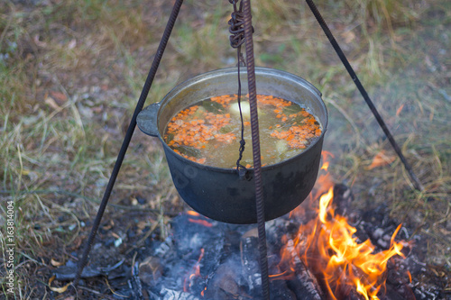 Cooking soup on fire