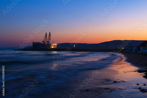 Beach on black sea coast at dusk after sunset in Balchik city
