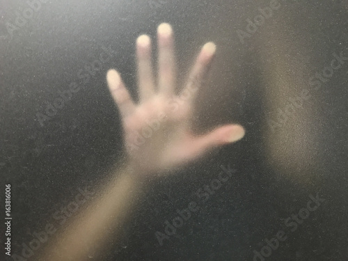 hand action behind window