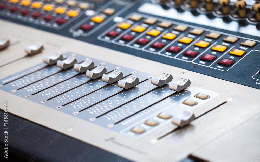 Close view of mixing console faders Close view of mixing console faders