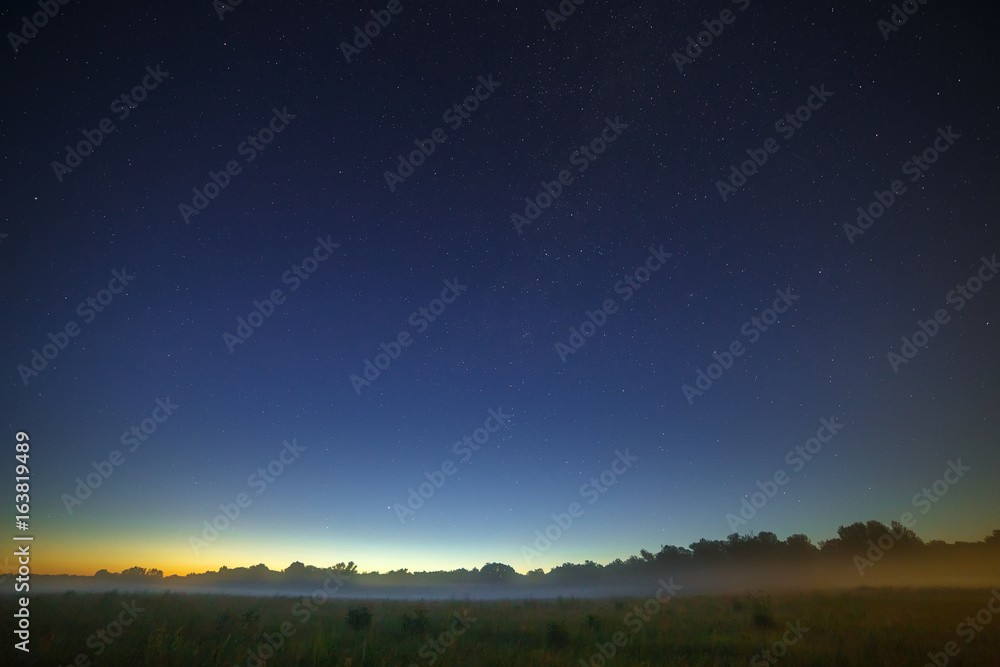 Fototapeta premium Stars of the Milky Way galaxy in the night sky. Space in the background of the morning dawn.