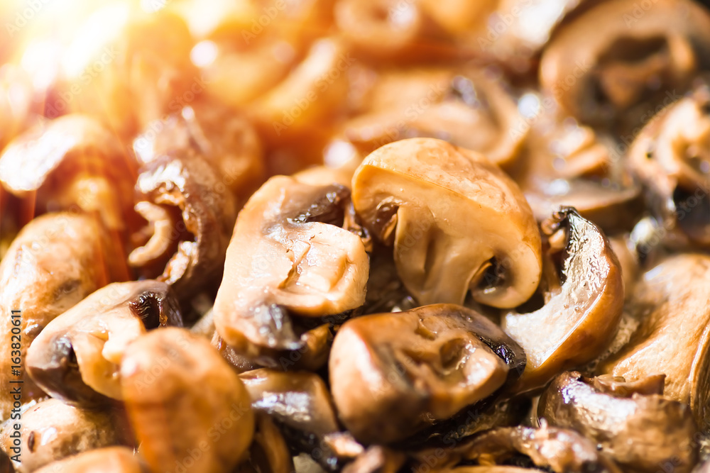 Roasted mushrooms closeup, background Roasted mushrooms closeup, background