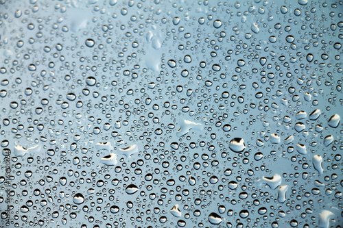Raindrops on window glass , rainy day