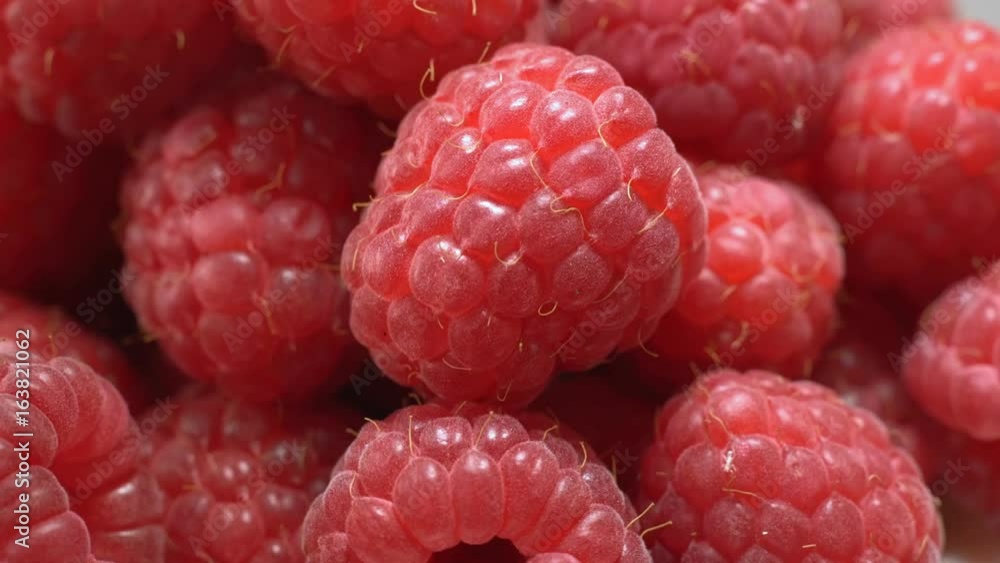 Ripe raspberries rotate in front of the camera Ripe raspberries rotate in front of the camera