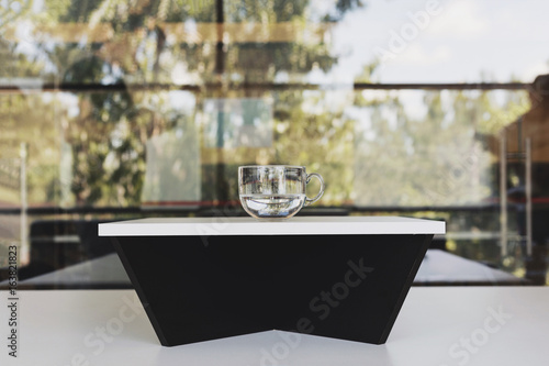 Fotografie Cup of water. Beautiful reflection of tree