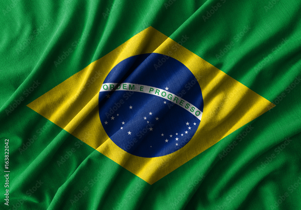 Fototapeta premium Brazil flag painting on high detail of wave cotton fabrics .