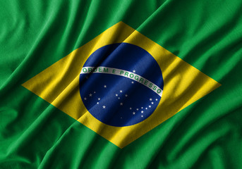 Fototapete Brasilien Brasilianische Flagge auf gewelltem Baumwollstoff  © stockdevil